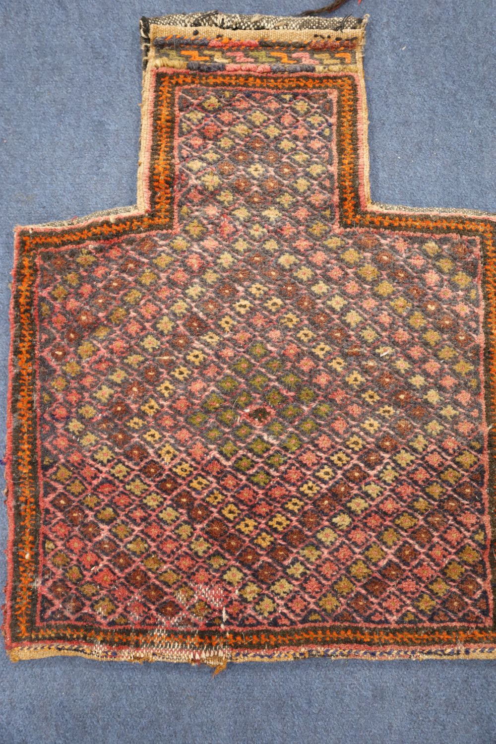 Two Afghan salt bags, a similar saddle bag and a Caucasian rug (4)